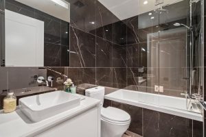 SMALL BATHROOM WITH RECESSED SIDLER DIAMANDO LIT MIRRORED CABINET - HEATHER & SEVENTEENTH, VANCOUVER, BC