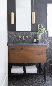 bathroom design with dark stone wall