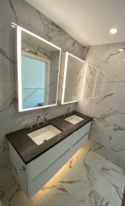 Kai Kitsilano Bathroom design with lit LED mirrored cabinet