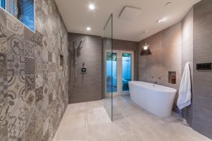 bathroom design with open shower and bathtub