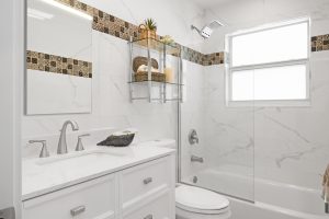 accent tile in bathroom design with lit mirrored cabinet